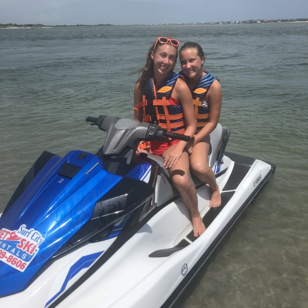 2 girls on a jet ski.