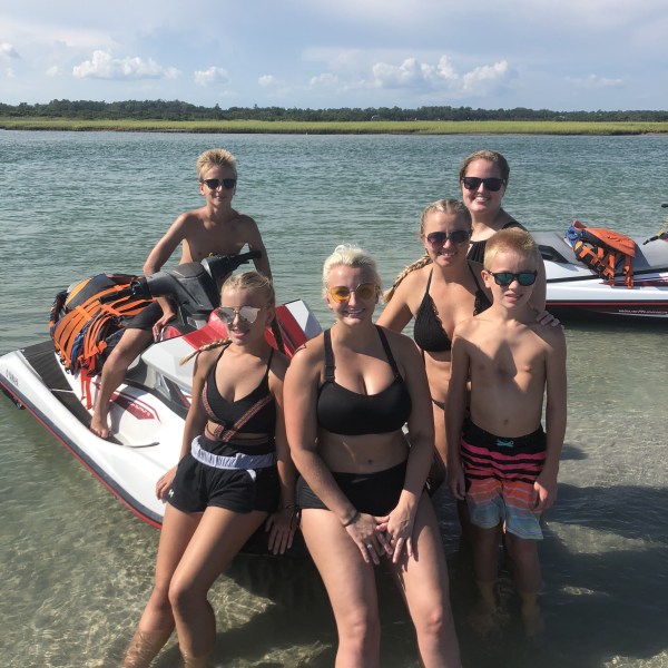A family getting ready to ride jet ski's.