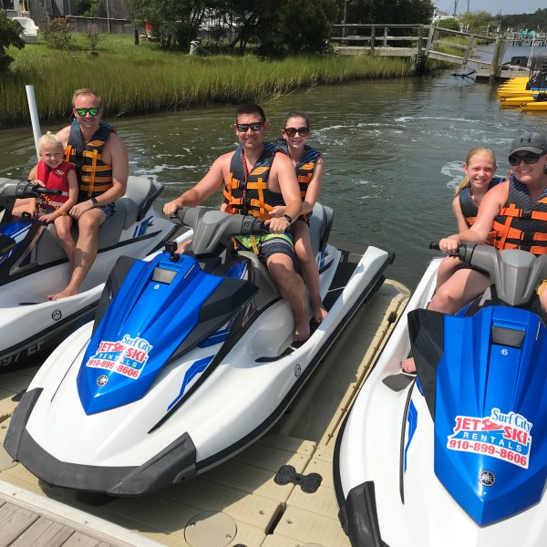family on jet skis.