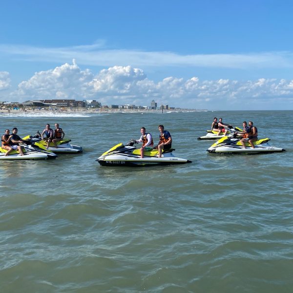 a group of people in a boat on a body of water