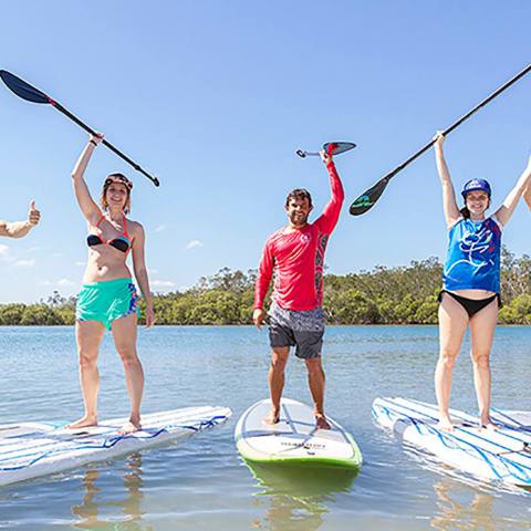 a group of people on a beach