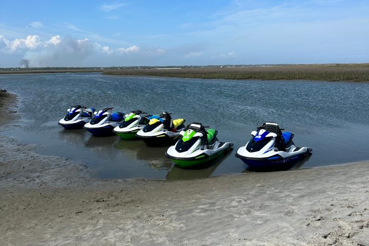 a group of people in a boat on a body of water