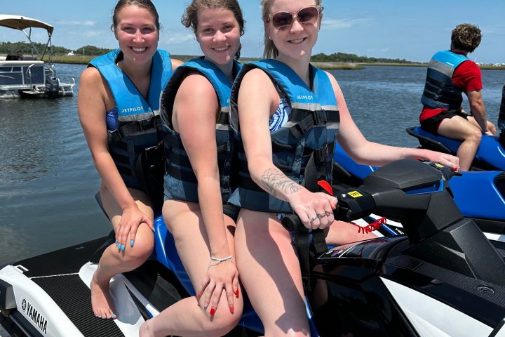 a group of people sitting on a boat