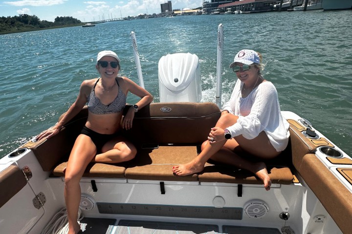 a group of people in a boat on a body of water