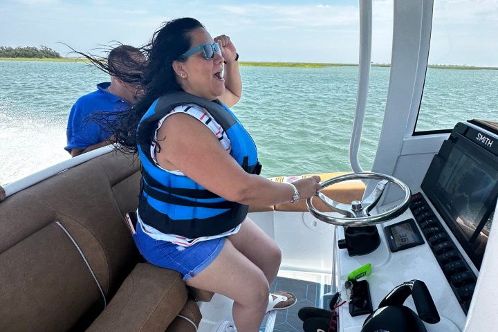 a person sitting on a boat in the water